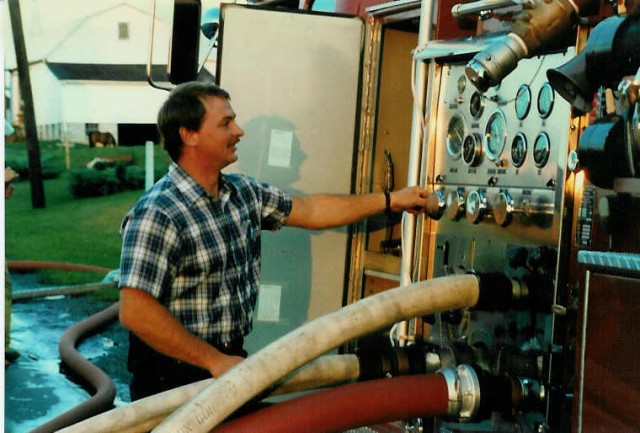 John Beyer pumping the 1979 pumper at pump training... July 1986